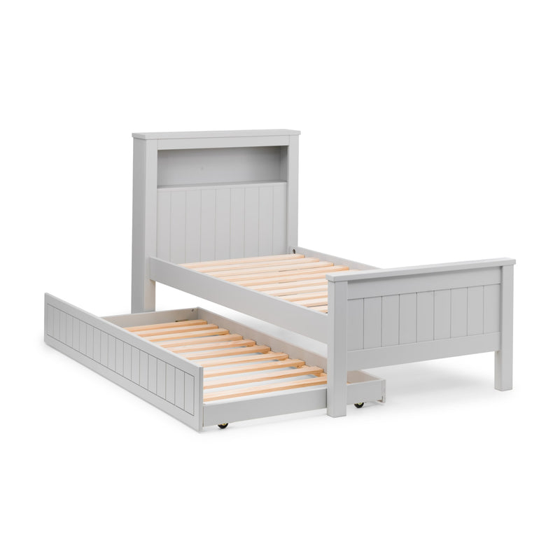 White wooden bed with a trundle on a white background