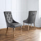 Two gray upholstered chairs with wooden legs on a wooden floor.