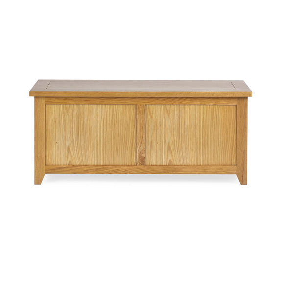 Wooden storage bench with a light finish on a white background