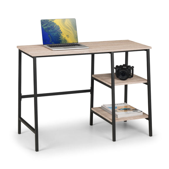 Wooden desk with a laptop and camera on a white background
