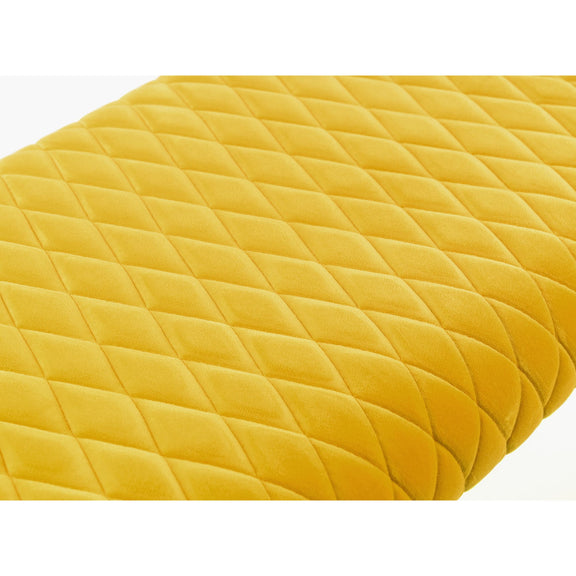 Yellow quilted fabric on a white background