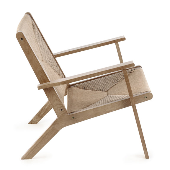 Beige lounge chair with woven backrest on a white background