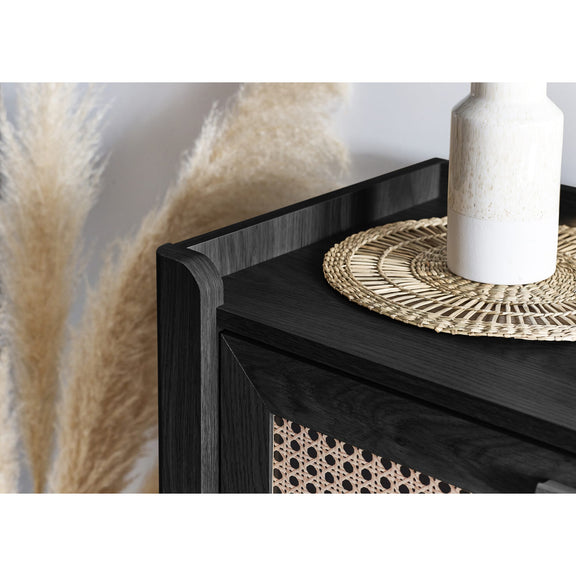 Close-up of black wooden top surface on 3 drawer chest
