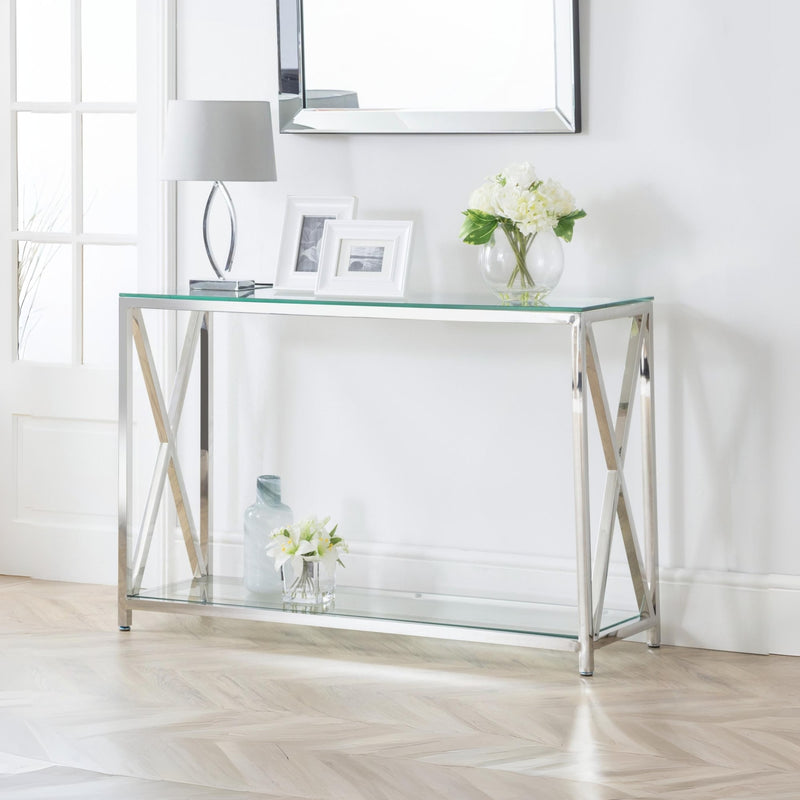 Glass console table with metal frame in a room setting