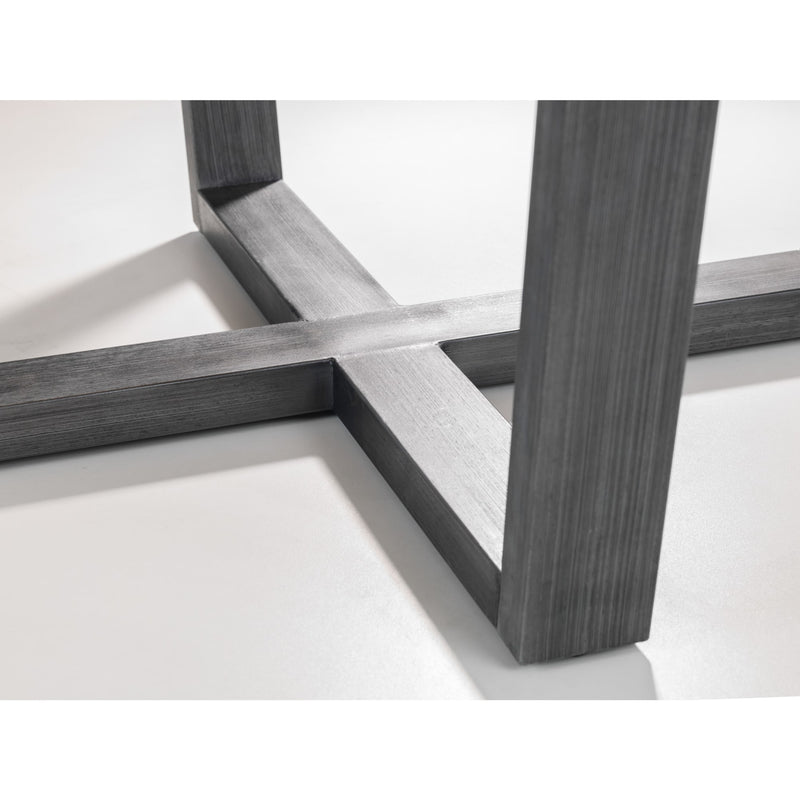 Close-up of a modern furniture leg with cross-brace design on a white background
