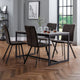 Dining room with a table and chairs on a wooden floor.