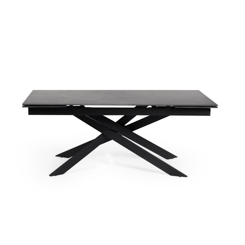 Black dining table with X-shaped legs on a white background