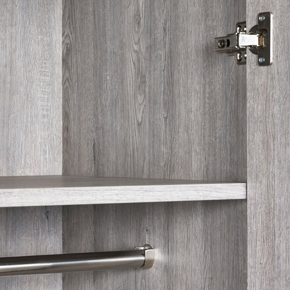 Close-up of a cabinet with a wooden finish and metallic handle.
