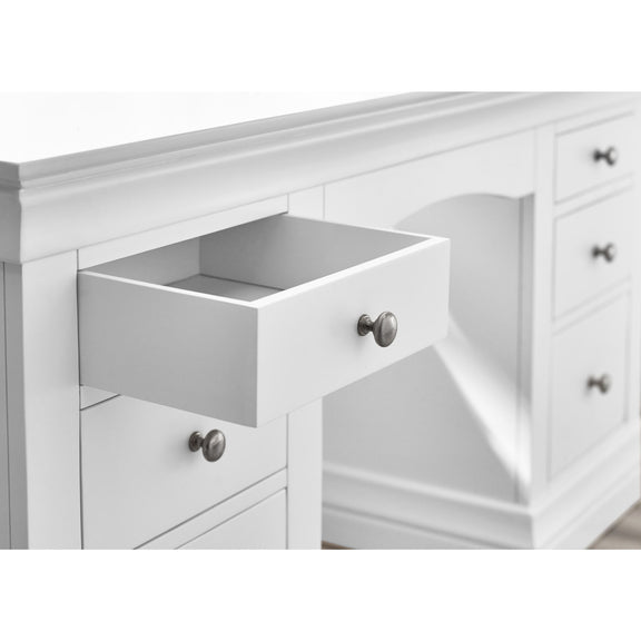 White dresser with open drawer and visible hardware