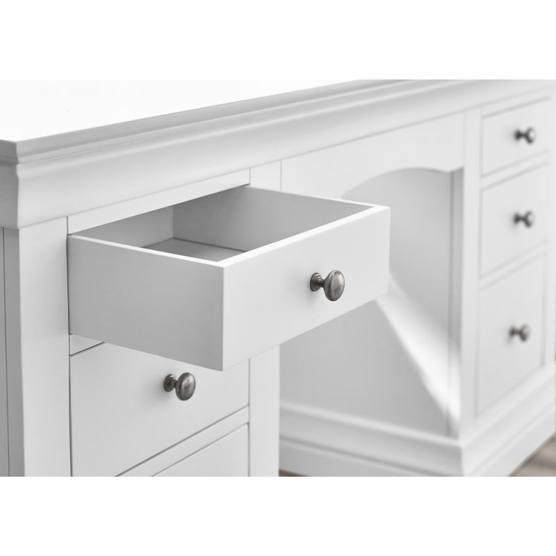 White dresser with open drawer and visible hardware
