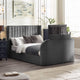 Gray upholstered bed in a bedroom setting with nightstands and decor.