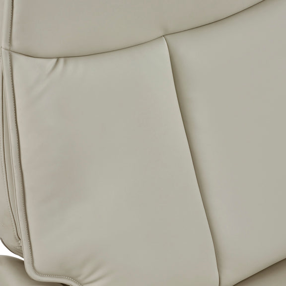 Close-up of beige leather car seat with stitching details
