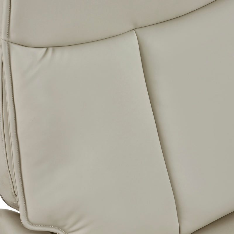 Close-up of beige leather car seat with stitching details
