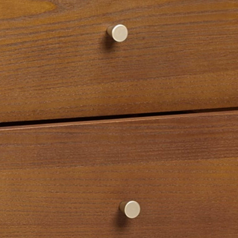 Close-up of a wooden drawer with a knob