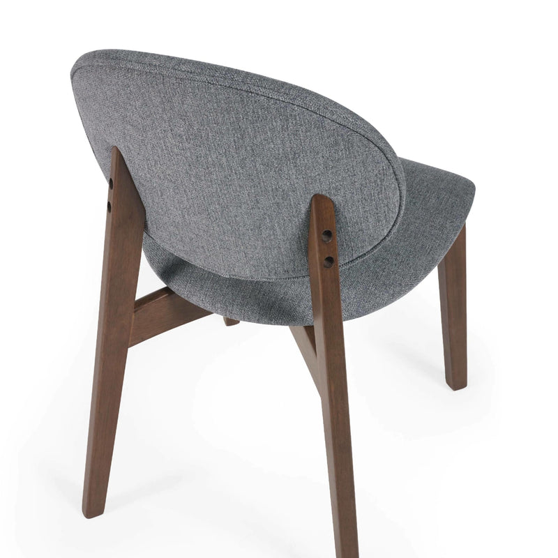 Chair with gray cushioned backrest and wooden legs on a white background