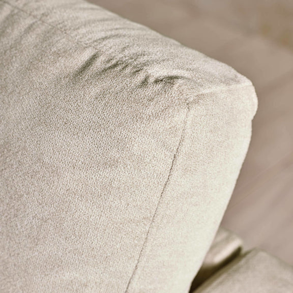 Close-up of a textured beige fabric surface