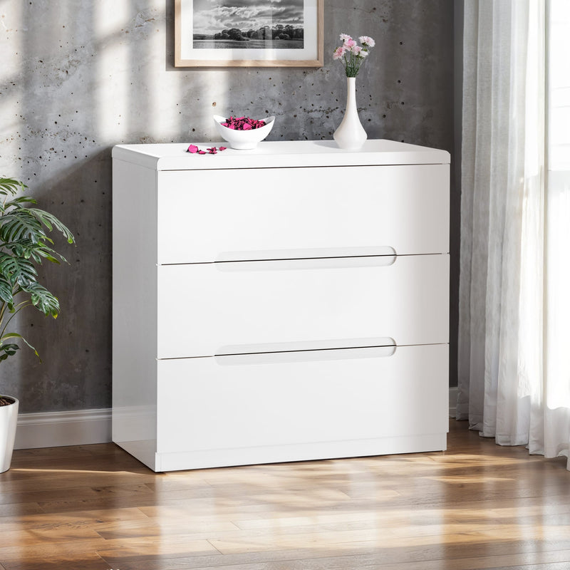 White dresser with decorative items against a gray wall