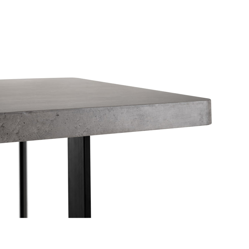 Concrete table with black metal legs on a white background
