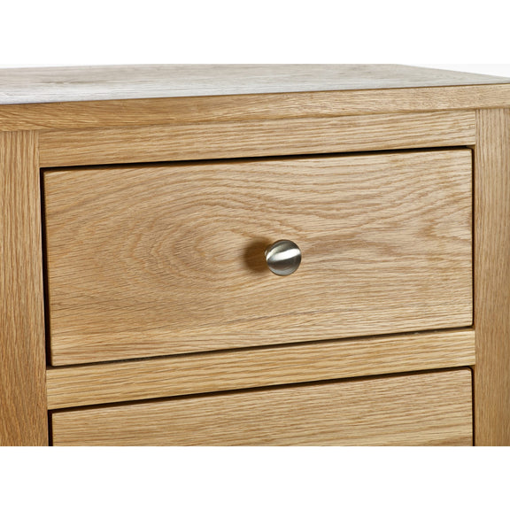 Wooden drawer with a silver handle on a white background