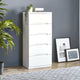 White dresser with decorative items against a gray wall with framed pictures.