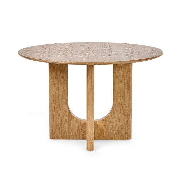 Round wooden table with a light finish on a white background
