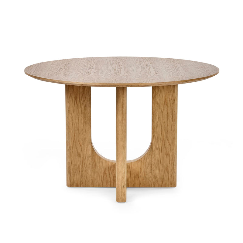 Round wooden table with a light finish on a white background