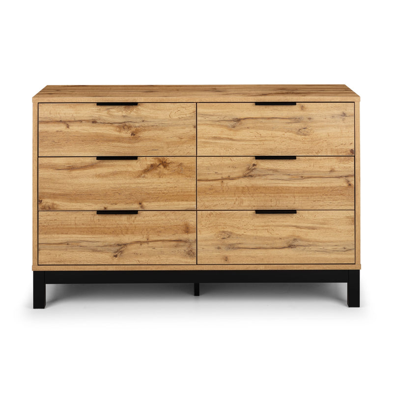 Wooden dresser with six drawers on a white background