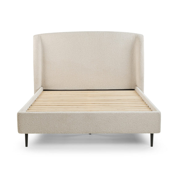 Beige upholstered bed with wooden slats on a white background