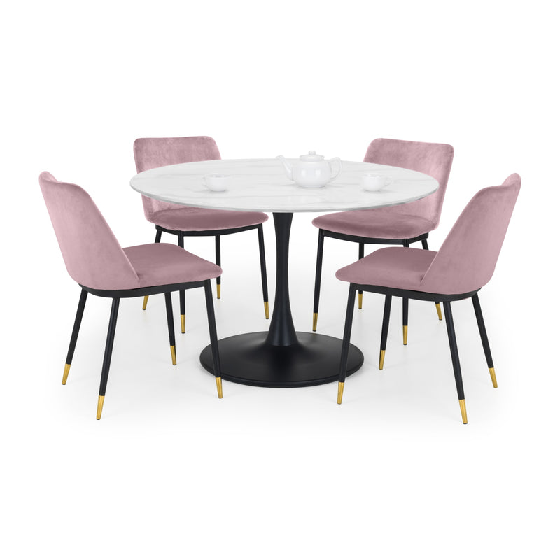 Round dining table with four pink chairs on a white background