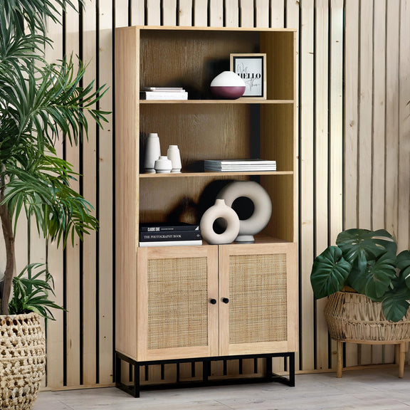 Wooden bookshelf with decorative items against a wooden wall with plants around.