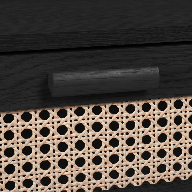 Close-up of black drawer handle and woven rattan drawer front