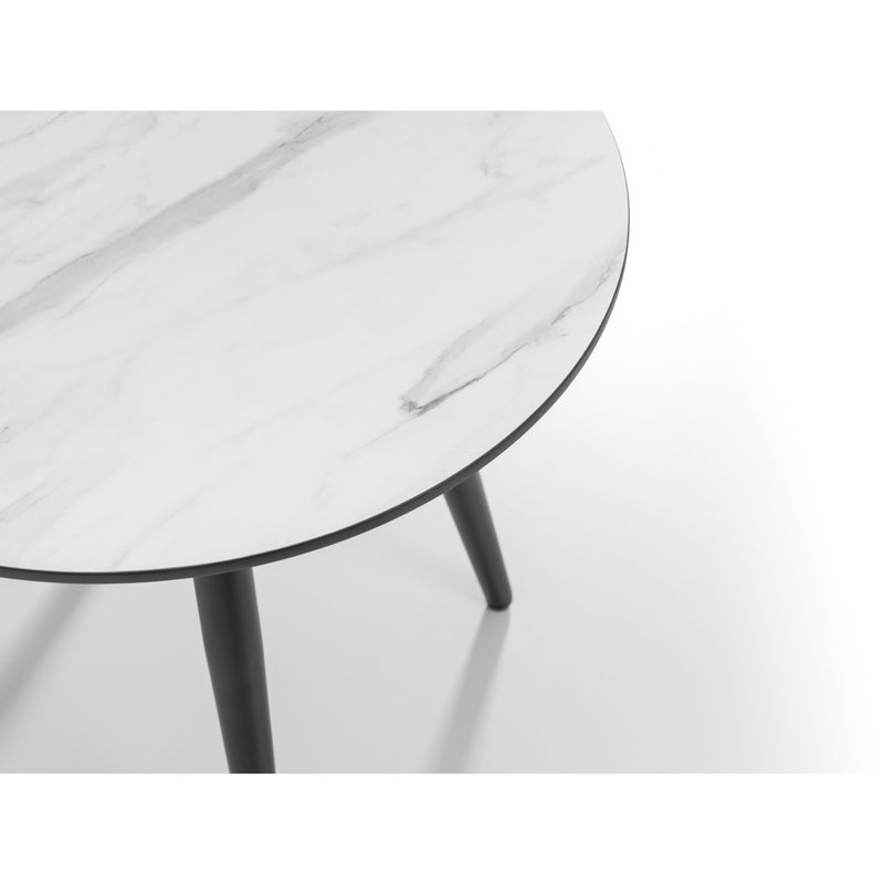Round marble table with black legs on a white background