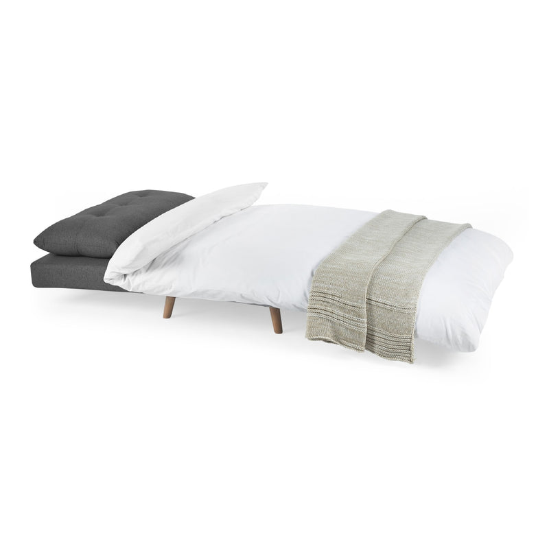 Bed with gray, white, and green bedding on a white background