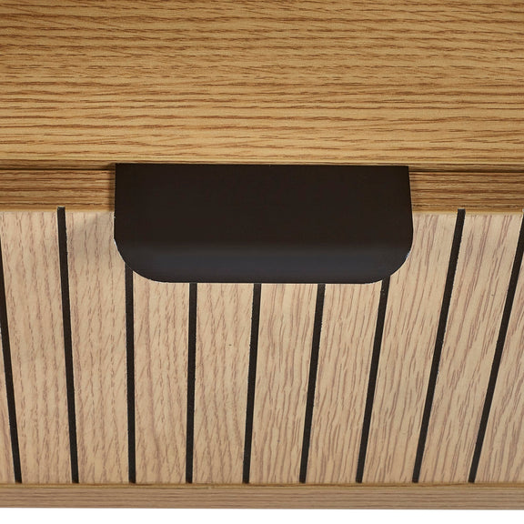 Close-up of a wooden surface with a black rectangular object on top