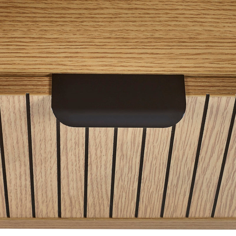 Close-up of a wooden surface with a black rectangular object on top
