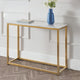 Console table with gold frame and marble top, featuring a blue vase and books against a white wall.