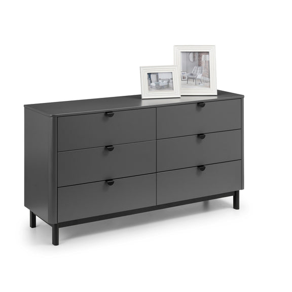 Gray dresser with four drawers on a white background