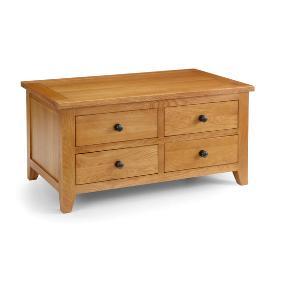 Wooden dresser with four drawers on a white background