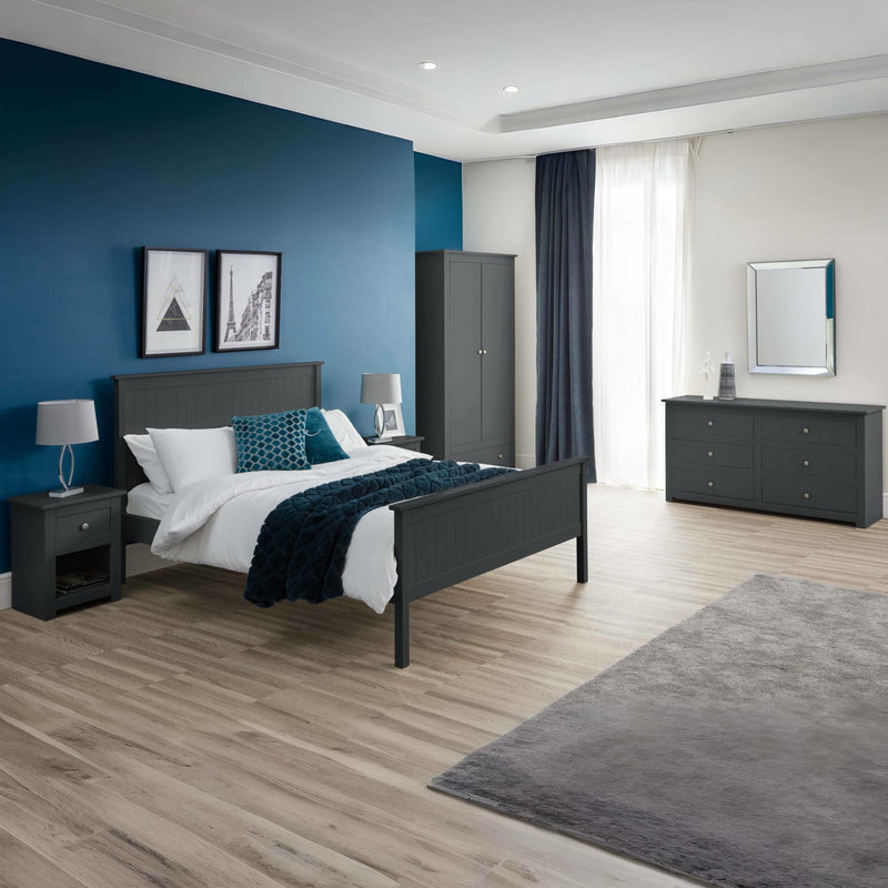Modern bedroom with gray bed, nightstands, and wardrobe against a blue wall.