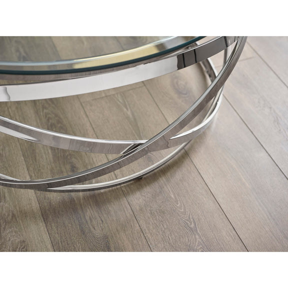 Glass coffee table with metal frame on a wooden floor