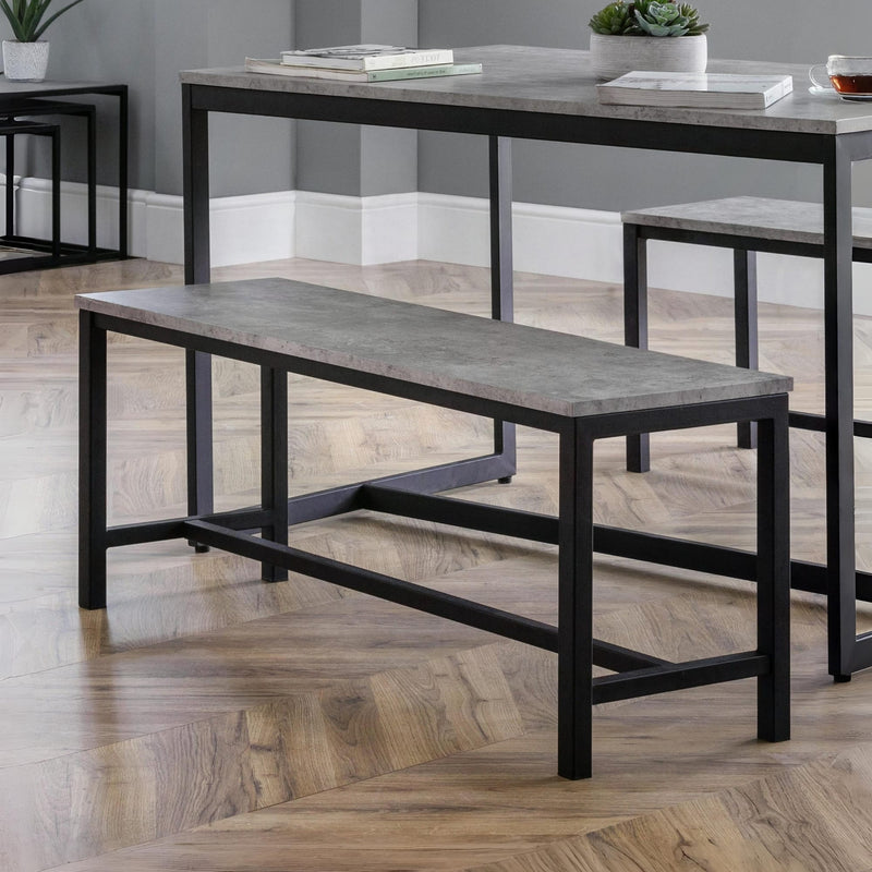 Modern bench and table set on a wooden floor with a neutral background