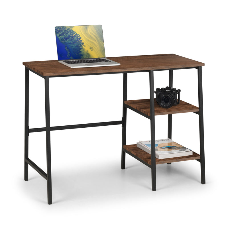Wooden desk with a laptop and camera on a white background