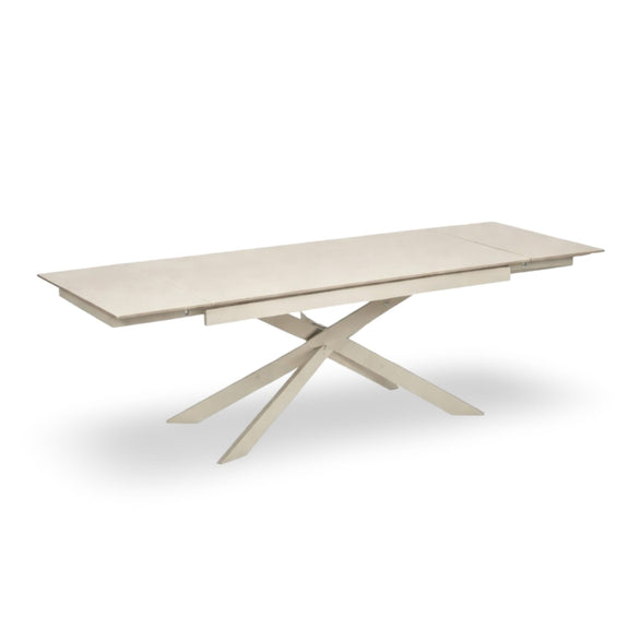 Beige extending dining table with a modern design on a white background