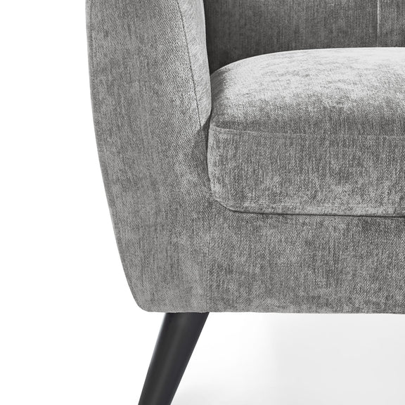 Gray upholstered chair with a black metal leg on a white background