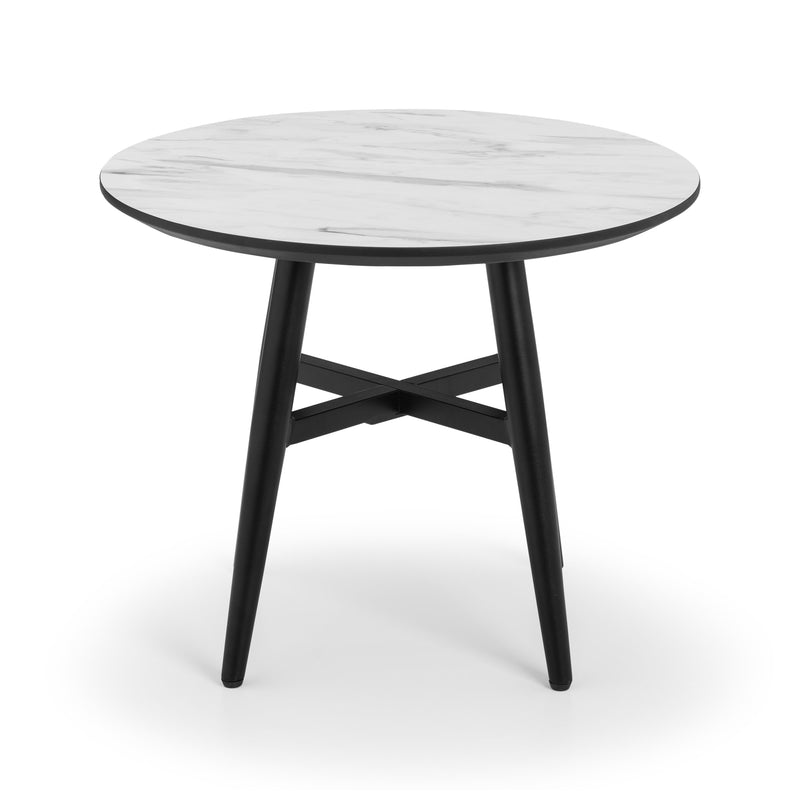 Round table with white marble top and black legs on a white background