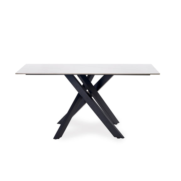 Rectangular table with a white top and black metal legs on a white background