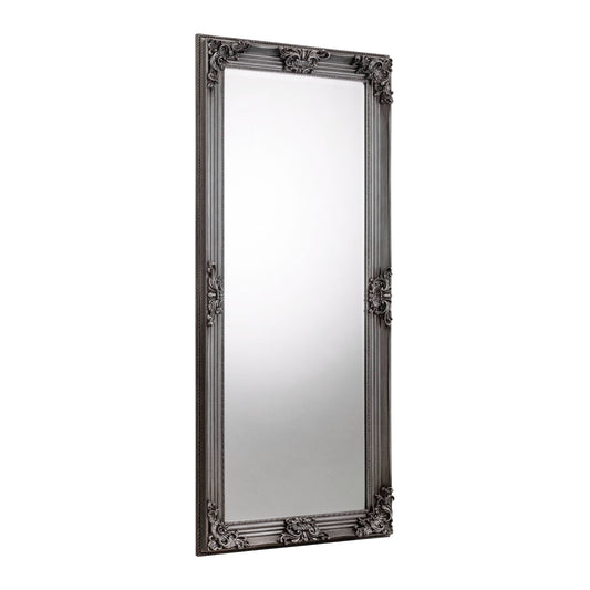 Decorative black-framed mirror on a white background