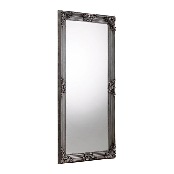Decorative black-framed mirror on a white background