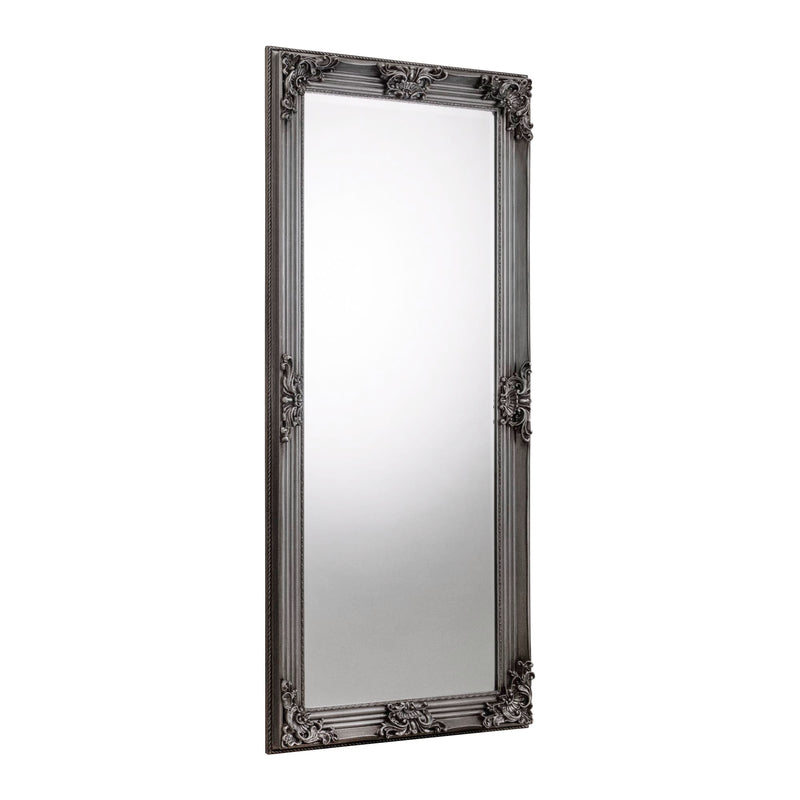 Decorative black-framed mirror on a white background