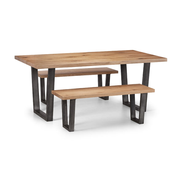 Wooden dining table with two matching benches on a white background